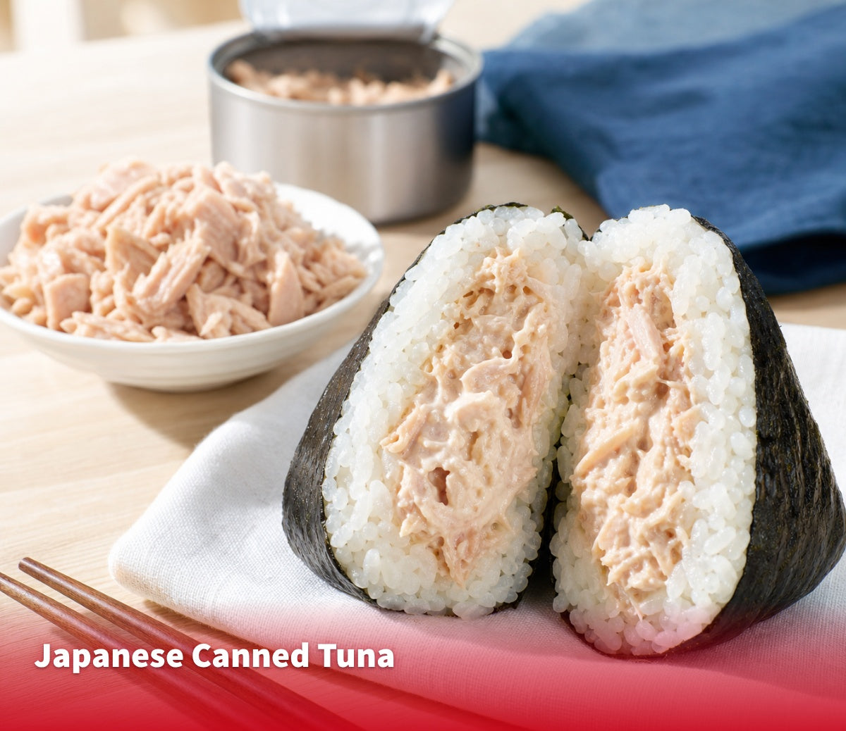 Tuna mayo onigiri cut open beside a dish of flaked canned tuna